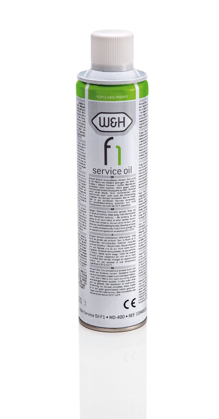 A can of W&H Service Oil MD-400 dental handpiece lubricant cans, part of the W&H brand, shown upright with green and white labels on a white background; these cans come without spray caps.