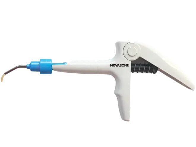 The NovaBone® Dental Putty Cartridge Dispenser by NovaBone is a white dental composite dispenser gun with a blue tip, designed for bone graft delivery and compatible with NovaBone cartridges during dental procedures.