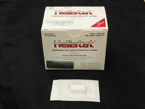 A box of Integra Helistat® 1690ZZ Absorbable Collagen Hemostatic Sponges (1” × ½”, Box/18) sits on a black surface, with one individually wrapped sponge in front—designed for surgical bleeding control and oral surgery hemostasis.