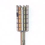 Close-up of a Dentech Bone Trephine, a cylindrical metallic bur by Dentech with vertical and horizontal grooves, commonly used in implant surgery for shaping teeth, restorative materials, or preparing sites for autogenous bone grafts.