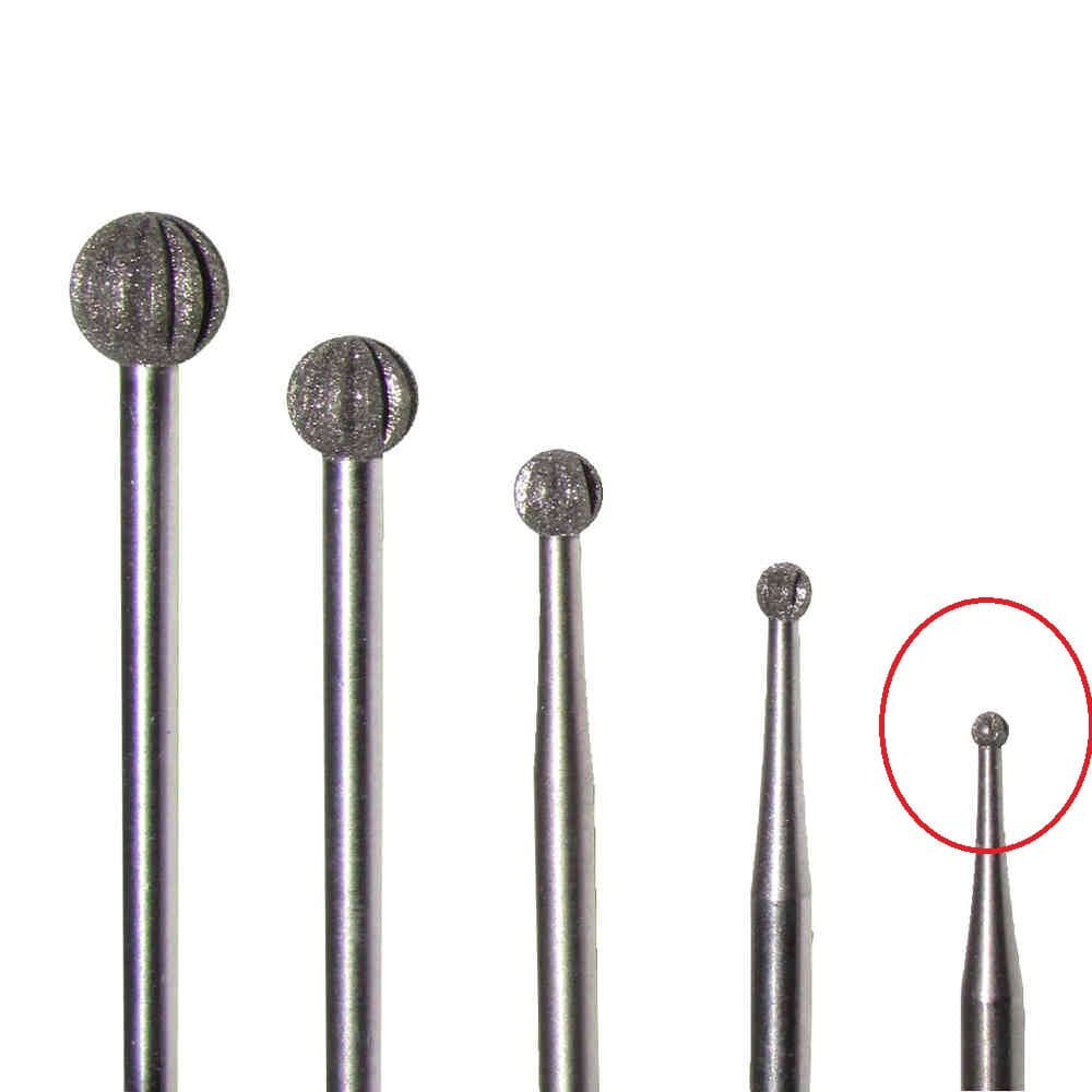 Five Dentech DIAMOND BUR ROUND tools of varying sizes stand upright on a white background; the smallest, a 1.2mm JNOTCH bur, is on the far right and circled in red.