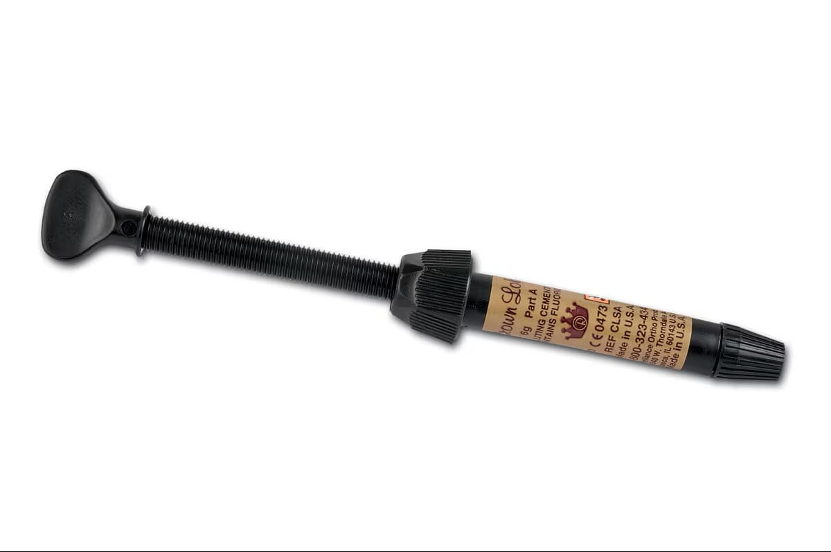 The Reliance Crown Lok Self-Curing Metal Luting Cement Part A (5g syringe) features a brown plastic applicator with black plunger and cap, plus beige label—ideal for precise dental cement application.