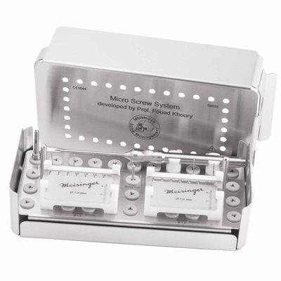 The Meisinger Khouri Micro Bone Screw System is a stainless steel dental micro screw kit designed for cortical bone graft fixation and bone augmentation procedures, featuring labeled slots for screws and tools, and an open lid displaying the organized contents inside.
