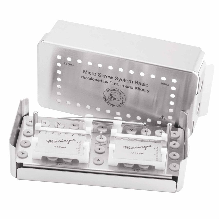 A silver metal box labeled "Meisinger Khouri Micro Bone Screw System" is open, revealing organized dental screws and tools from the Meisinger brand inside. The components, ideal for bone augmentation and cortical bone graft fixation procedures, are neatly arranged in slots within the container.