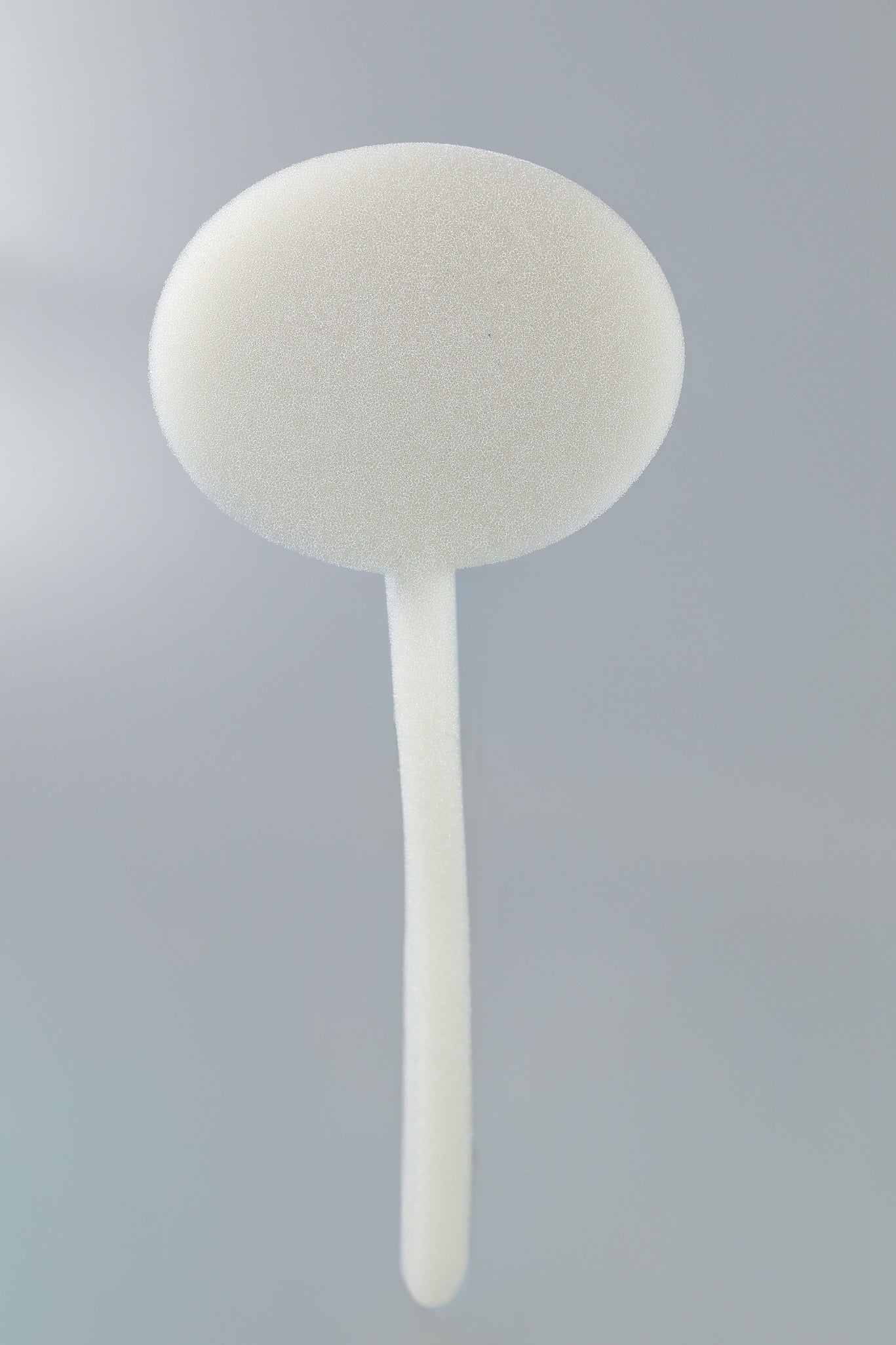 The Xemax C-Sponge III Surgical Throat Pack with a long retrieval tail is shown against a plain light gray background; this polyurethane foam applicator is supplied in a bag of 100.