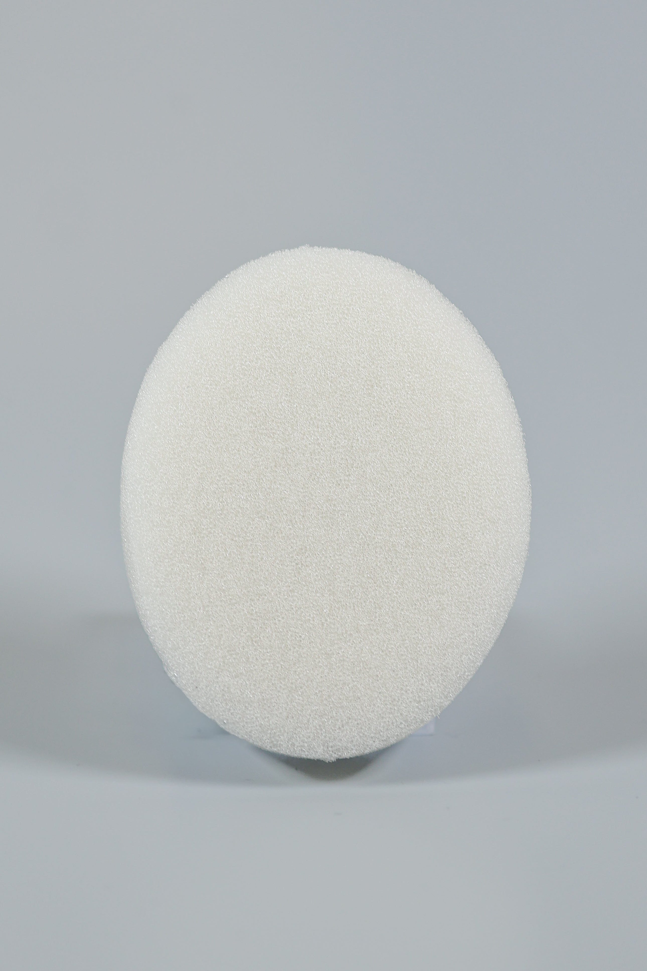 The Xemax C-Sponge Pedo, a reduced-size, white, textured pediatric surgical throat pack (bag of 50), is centered against a plain light gray background.