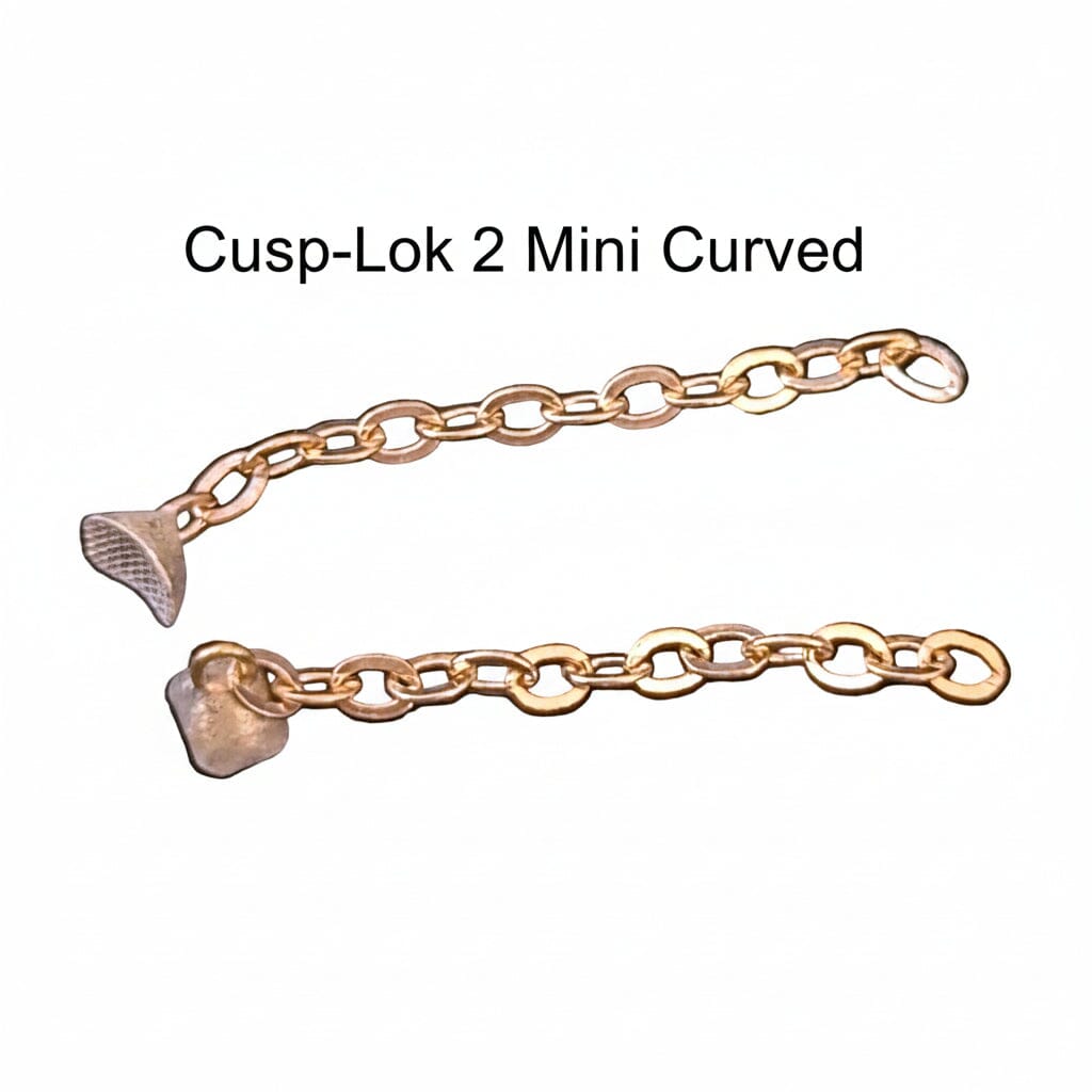 The Xemax Cusp-Lok 2 features two 1" 14K gold mini curved chains with different shaped ends, designed for bracket-based impacted cuspid traction, shown on a white background.