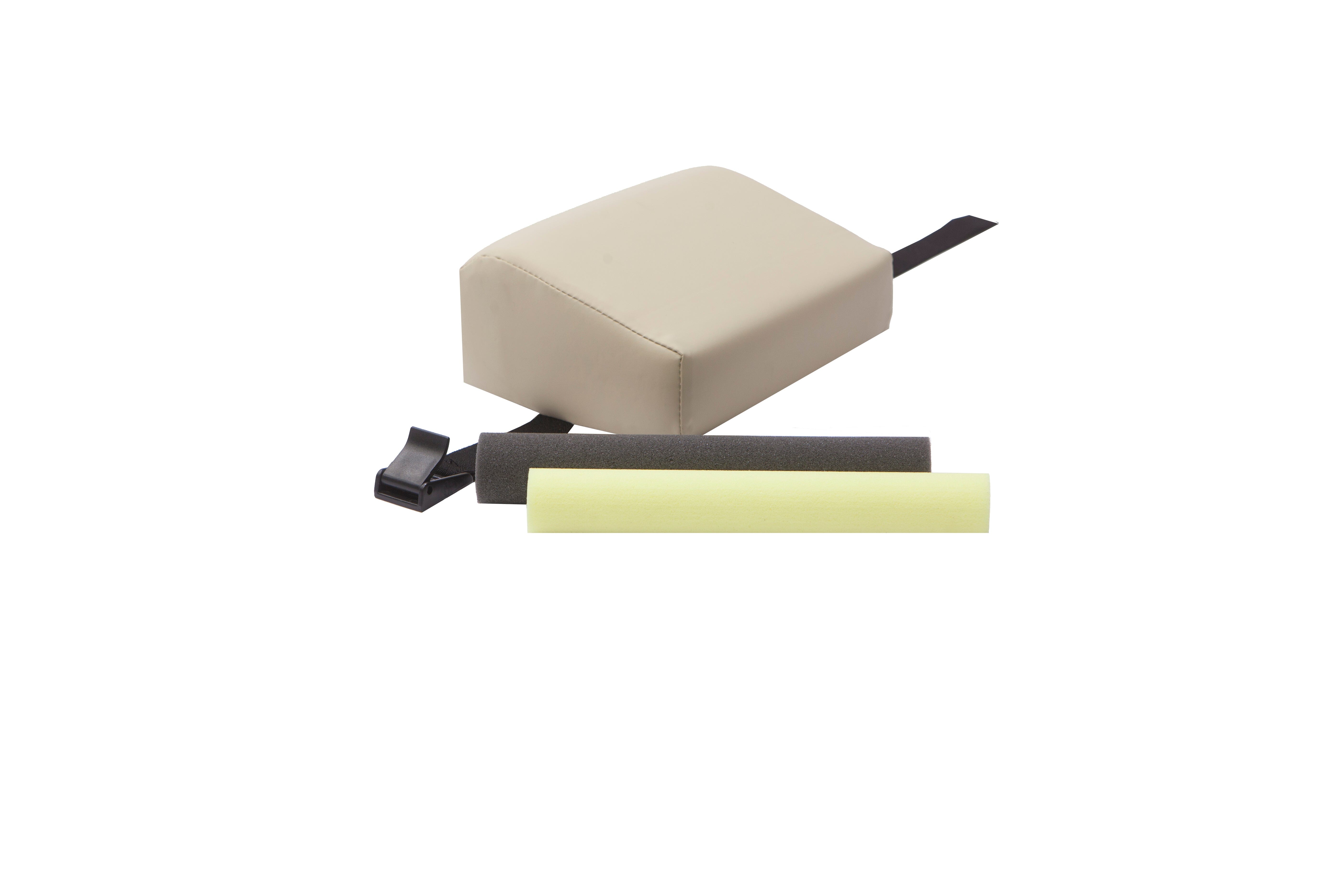 The Mediposture 3.5" iCore Memory Headrest for Dental Chairs by Mediposture is a beige rectangular padded cushion with a black strap, shown with one black and one yellow foam insert, all displayed on a white background.