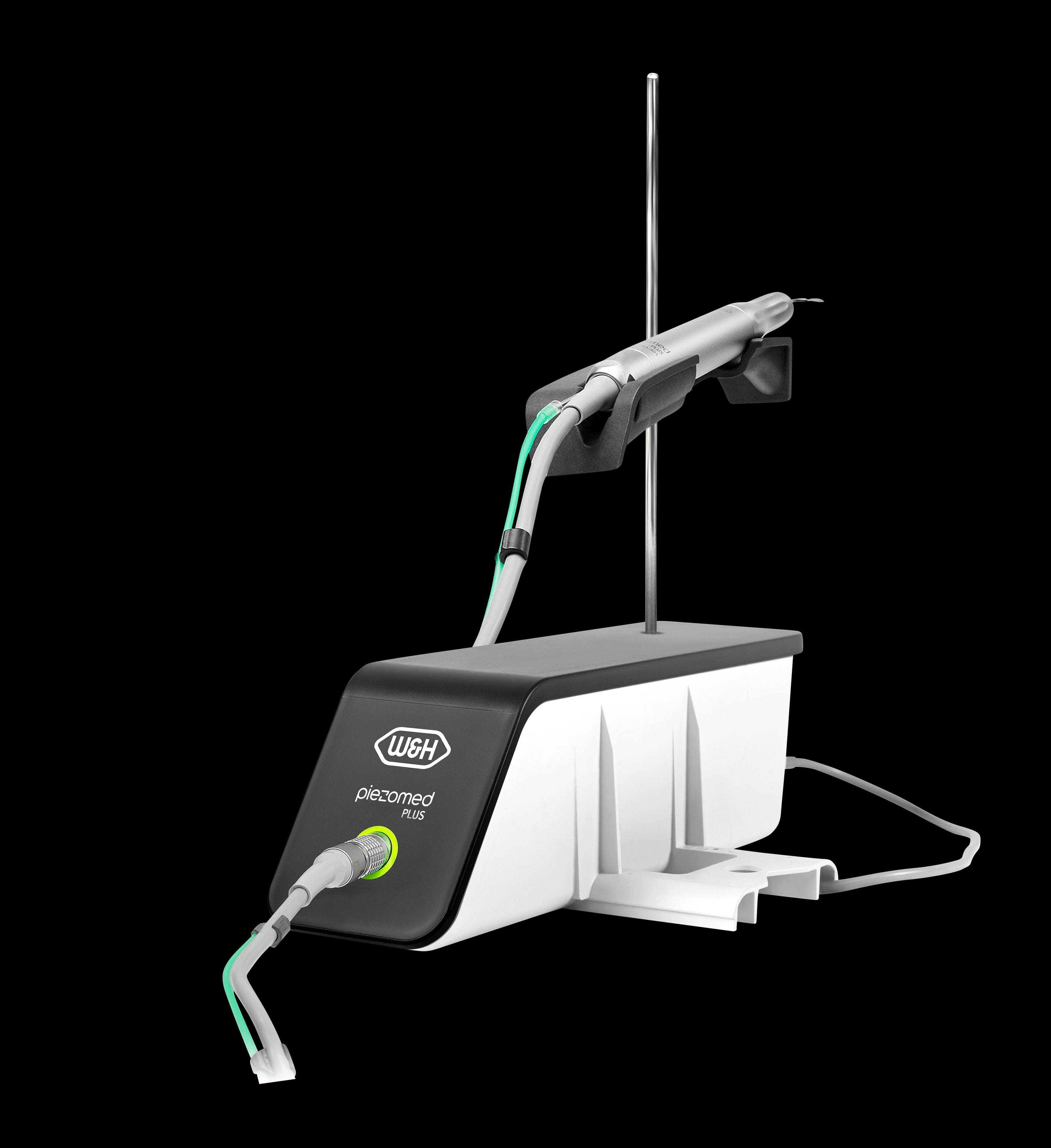 The W&H Piezomed Plus Set – SA-435M dental device features a handpiece and control unit for bone-selective ultrasonic surgery, connected by cables and shown against a black background.