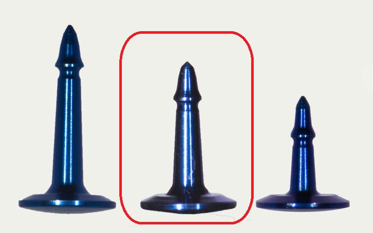 Three blue SuperTack Fixation Tacks – Titanium GBR (3mm, 4mm, 5mm) by McBio are displayed upright on a light background. The middle tack is outlined in red, and each differs slightly in height and shape.