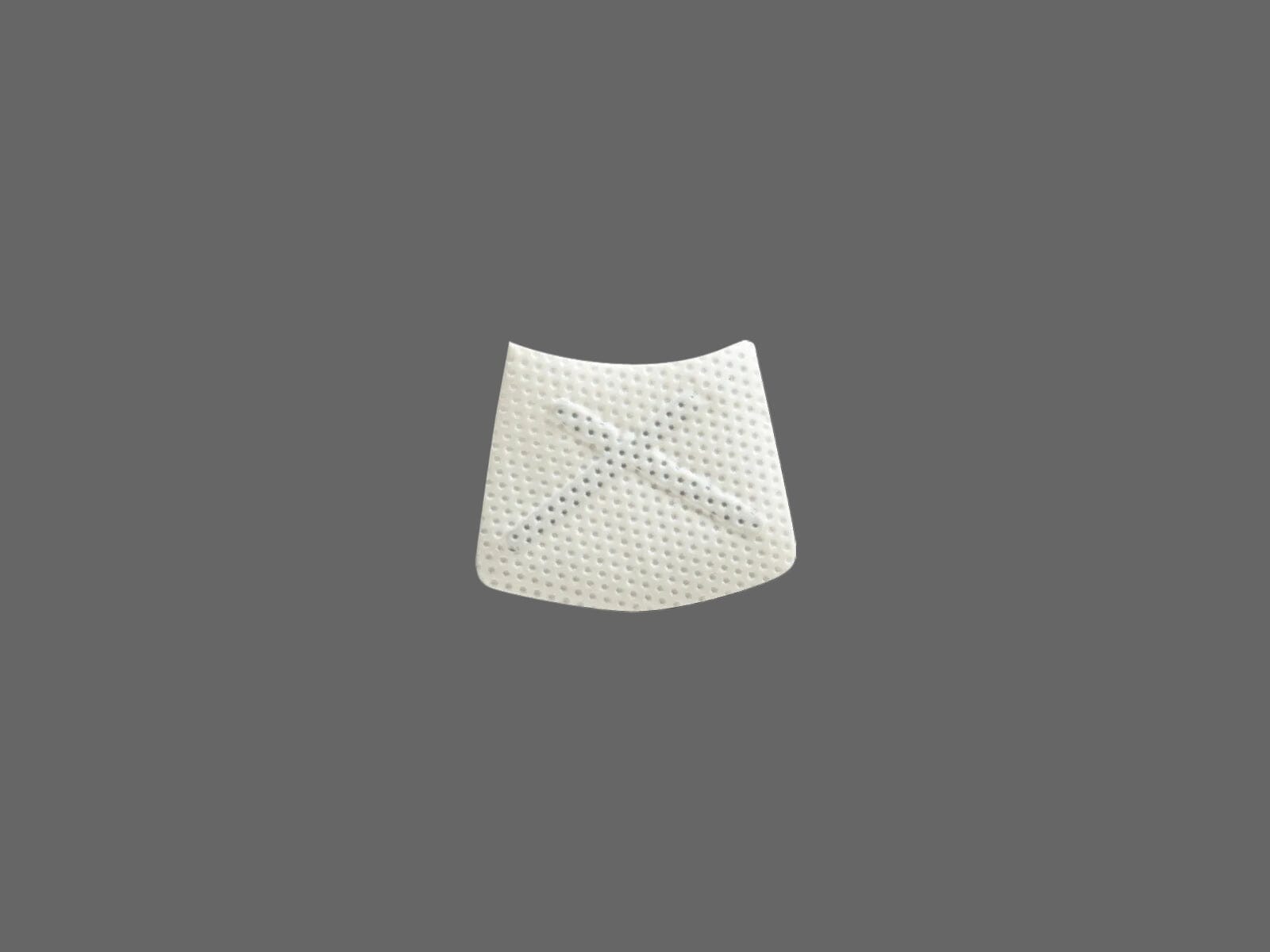 The Osteogenics Cytoplast™ Ti-250 Titanium-Reinforced PTFE Membrane (250 μm) is a small, white, textured membrane with an indented X shape at the center, shown against a solid gray background.