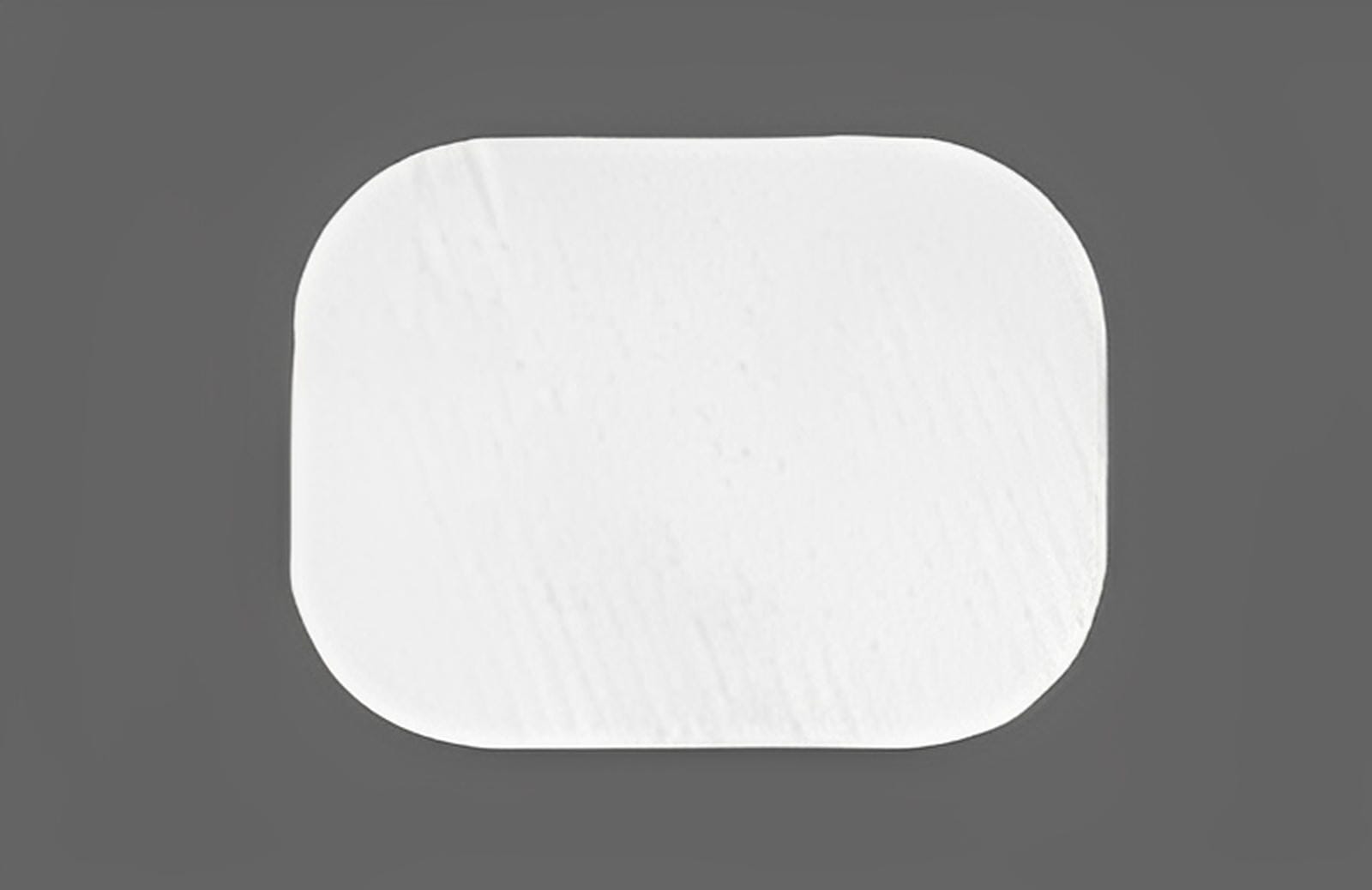 A single white, rectangular ZMatrix™ Porcine Peritoneum Collagen Membrane by Osteogenics with rounded corners is shown against a plain gray background.