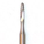 A close-up of the Dentech Lindemann Bur - Latch Type, a small metallic tool used by dentists for precise bone cutting during implant surgery.