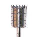 A close-up of the Dentech Bone Trephines by Dentech, a cylindrical metallic drill bit with sharp teeth and a notched edge, designed for cutting hard materials during implant surgery.