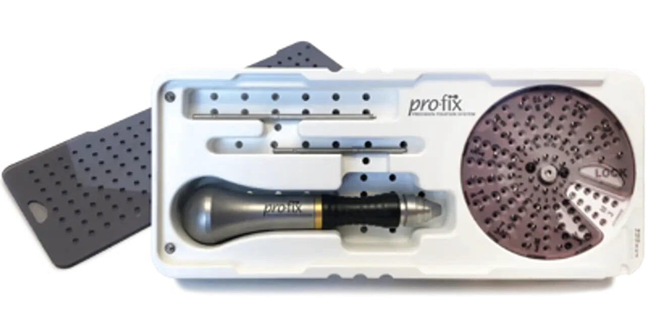 The Pro-Fix Tenting Intro Kit by Pro-Fix includes a handheld tool, a round metal disk with holes, and two rectangular plates with holes—parts of a fixation system—organized in a white tray.