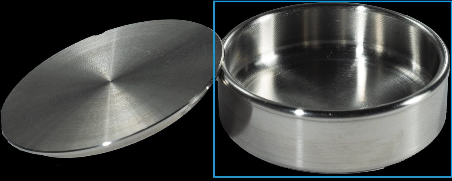 The McBio Bone Graft Container is a round, shallow surgical tray made of stainless steel with a brushed metal finish.