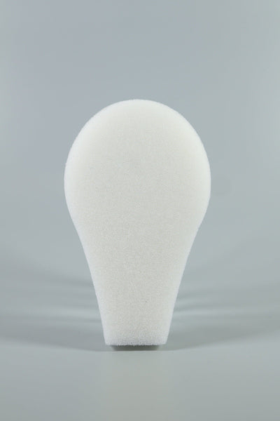 A white, teardrop-shaped C-Sponge II Surgical Throat Pack with integrated retrieval extension by Xemax is shown upright against a plain gray background.