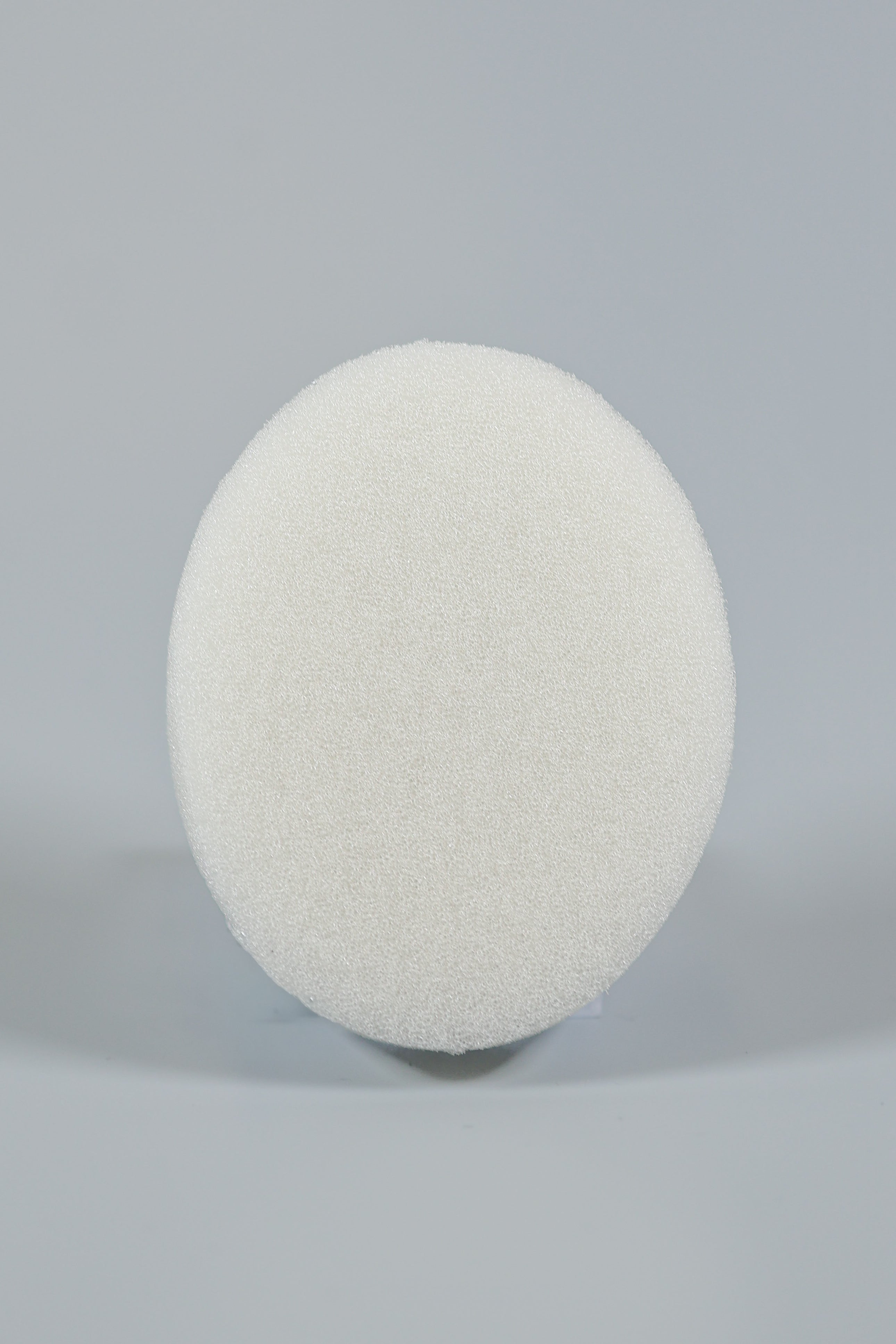 The Xemax C-Sponge Pedo, a reduced-size, white, textured pediatric surgical throat pack (bag of 50), is centered against a plain light gray background.