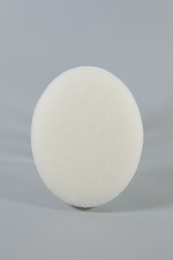 A round, white C-Sponge Regular Polyurethane Surgical Throat Pack by Xemax stands upright against a plain, light grey background.