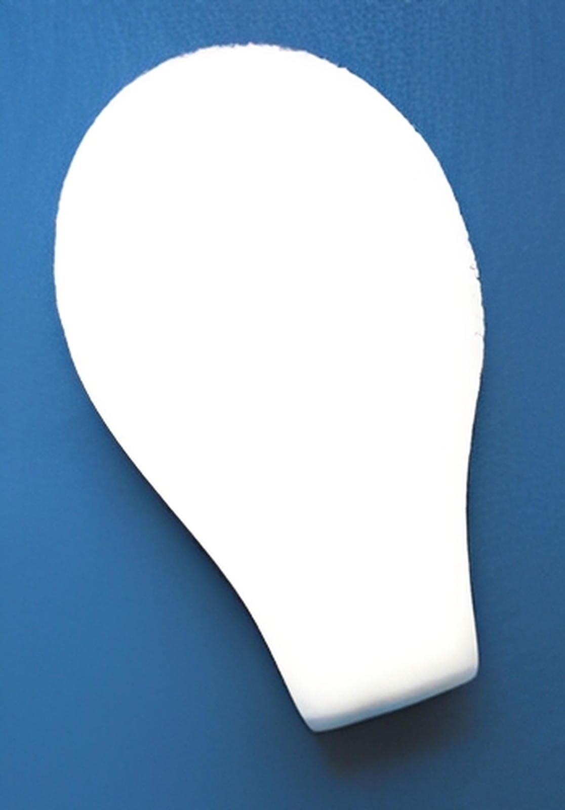 A smooth, white C-Sponge II Surgical Throat Pack by Xemax, shaped like a light bulb and featuring a retrieval extension, is set against a solid blue background. The pack lacks visible details or markings. Packaged in bags of 100.