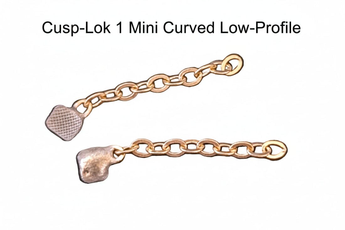Two small 3/4" 14K gold chains labeled Cusp-Lok 1 by Xemax, designed for bracket-based impacted cuspid traction, are shown on a white background.
