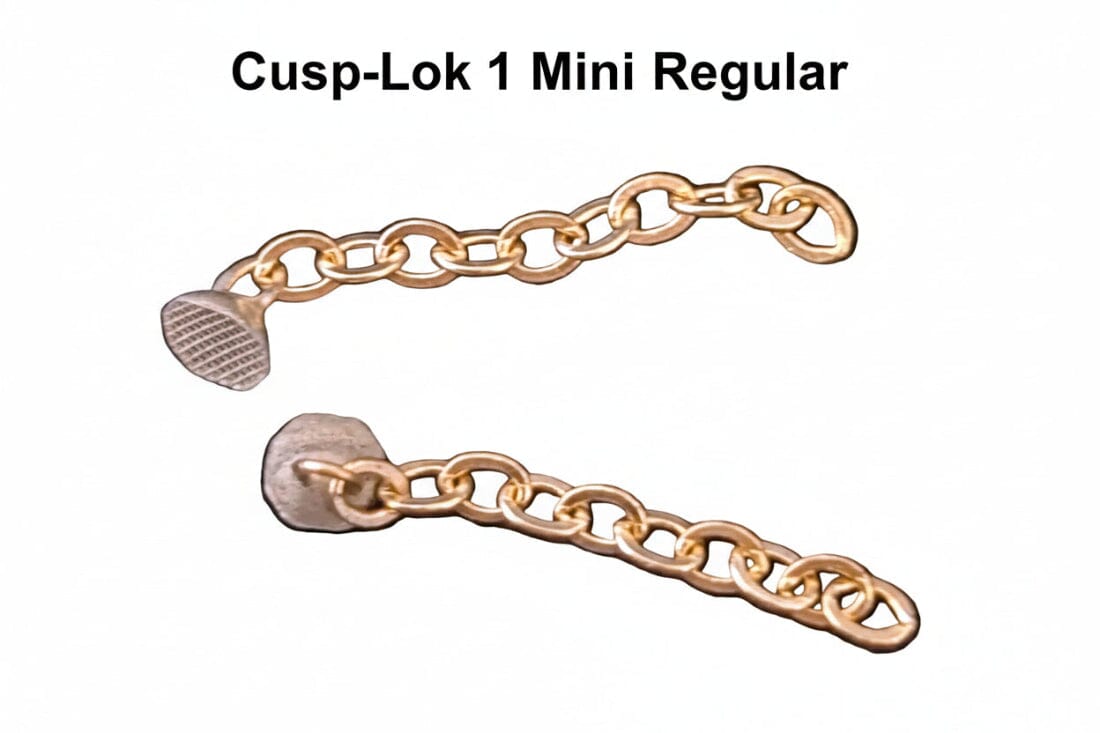 Two Xemax Cusp-Lok 1 bracket-based impacted cuspid traction chains, 3/4" long and made of 14K gold, are shown against a white background with textured metal ends for orthodontic use.