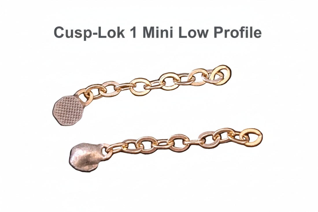 Two small 3/4" 14K gold dental chains from Xemax's Cusp-Lok 1 orthodontic bracket-based impacted cuspid traction system displayed on a white background, with "Cusp-Lok 1 Mini Low Profile" text above.