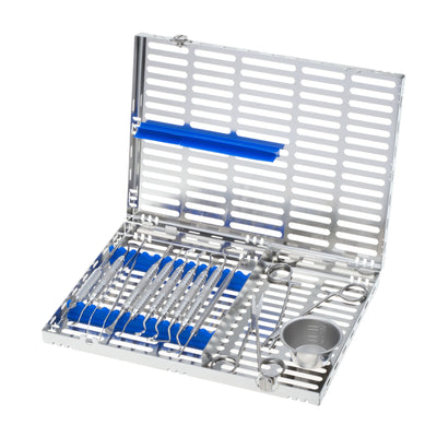 The Hu-Friedy Bone Grafting Kit features a metal case with blue holders, neatly organizing dental or surgical instruments such as probes, tweezers, and a small metal cup.