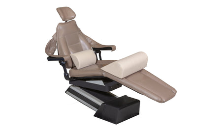 The Mediposture Knee Lift & iCore Memory Backrest Combo by Mediposture is a brown reclining dental or medical chair with headrest, armrests, cushioned supports, and an iCore memory backrest for enhanced patient comfort, isolated on a white background.