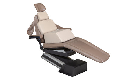The Mediposture Child Booster Seat with Kiddie Headrest – Pediatric Dental Chair Combo by Mediposture is shown reclined on a black base, featuring armrests and a brown adjustable design, isolated on a white background.