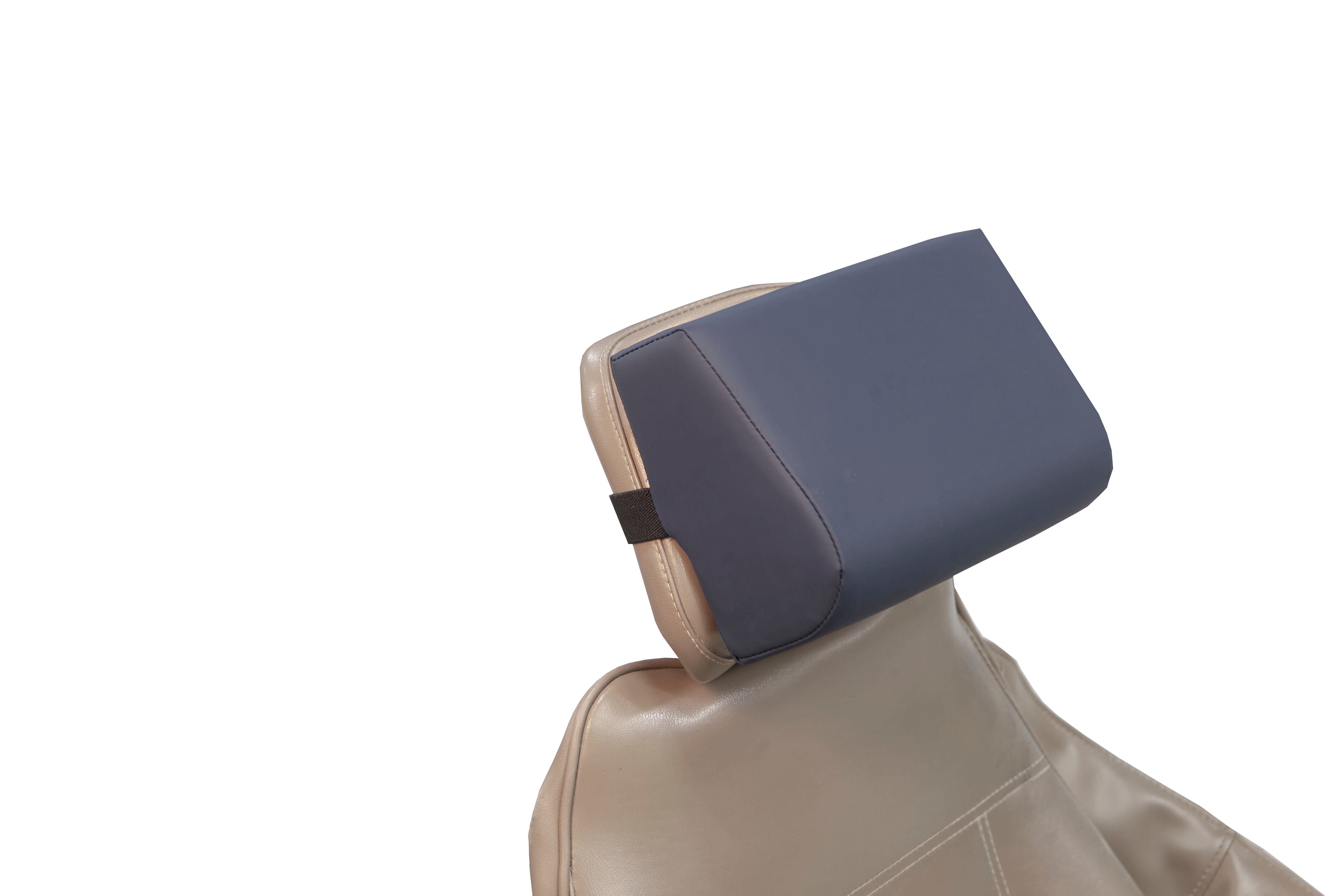A close-up of a car seat with a tan leather cover features the Mediposture 3.5" Classic Memory Headrest by Mediposture, a detachable rectangular dark blue cushion for enhanced comfort, attached to the top, set against a white background.