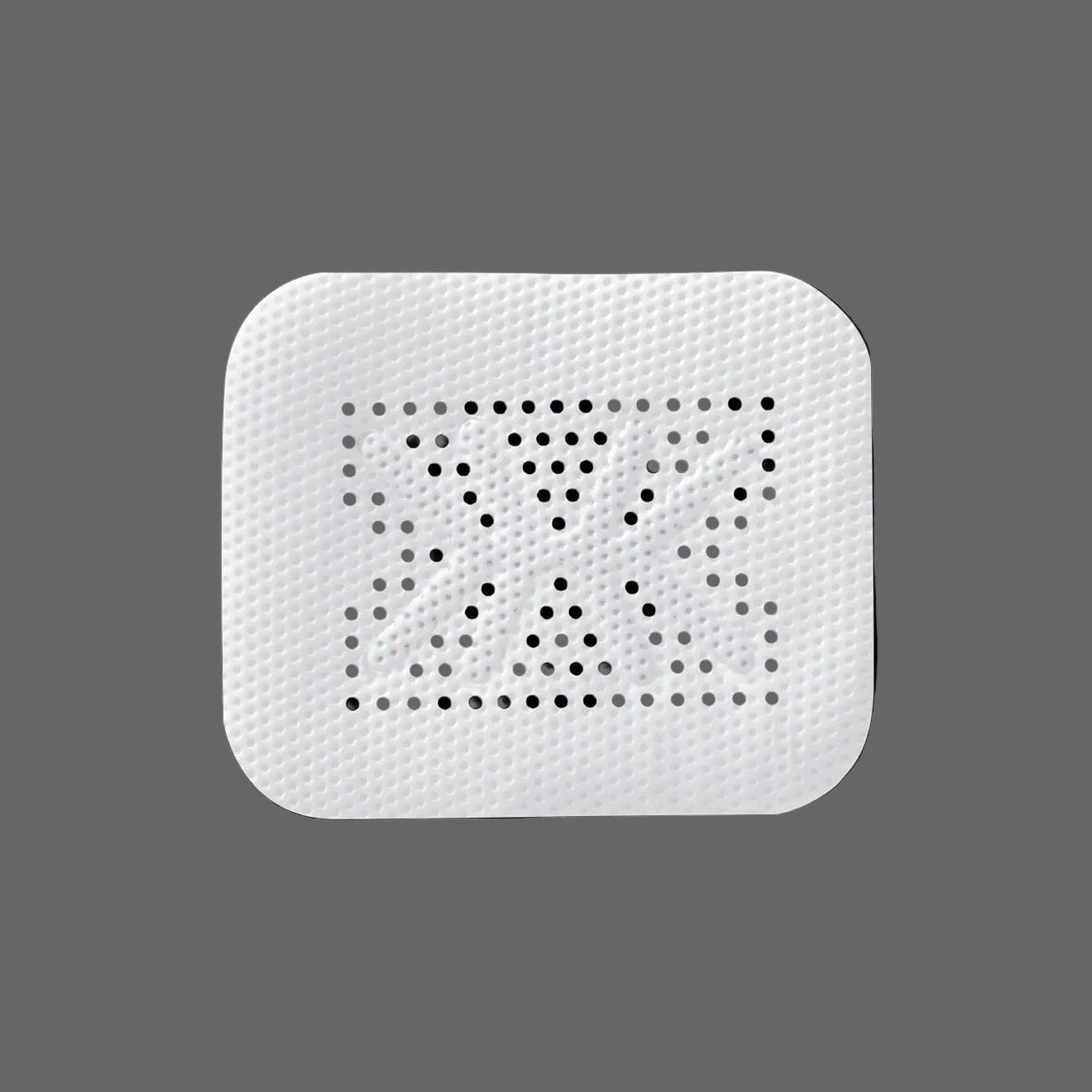 A rectangular white RPM™ Reinforced PTFE Mesh Membrane by Osteogenics, featuring an X-shaped pattern of holes and rounded corners, is displayed against a plain gray background.