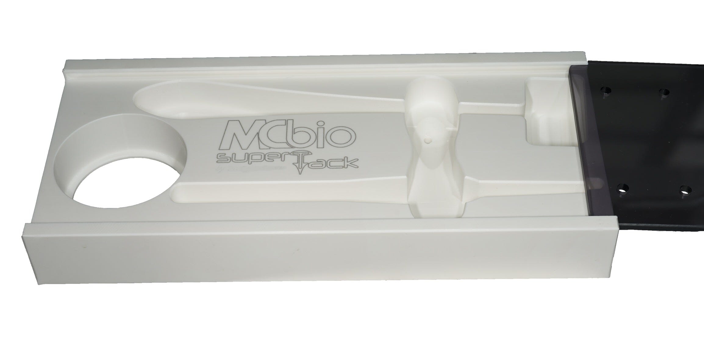 The McBio SuperTack Storage & Sterilization Box is a white medical-grade polymer plastic tray with a black right-side section, designed to hold items like a propeller-shaped tool and features a circular slot.