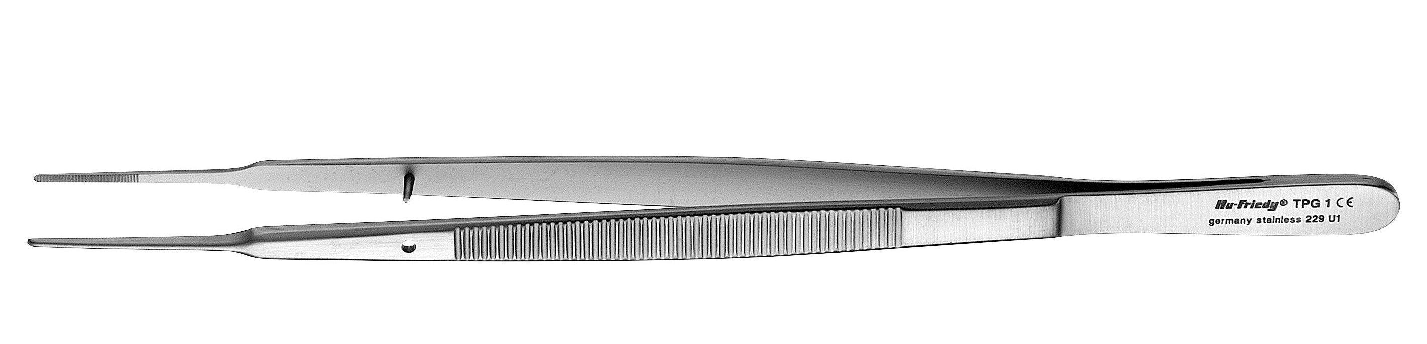 A pair of Hu-Friedy Gerald Tissue Forceps, made of stainless steel with ridged grips and pointed tips, rests on a white background. The handle shows visible text and markings.