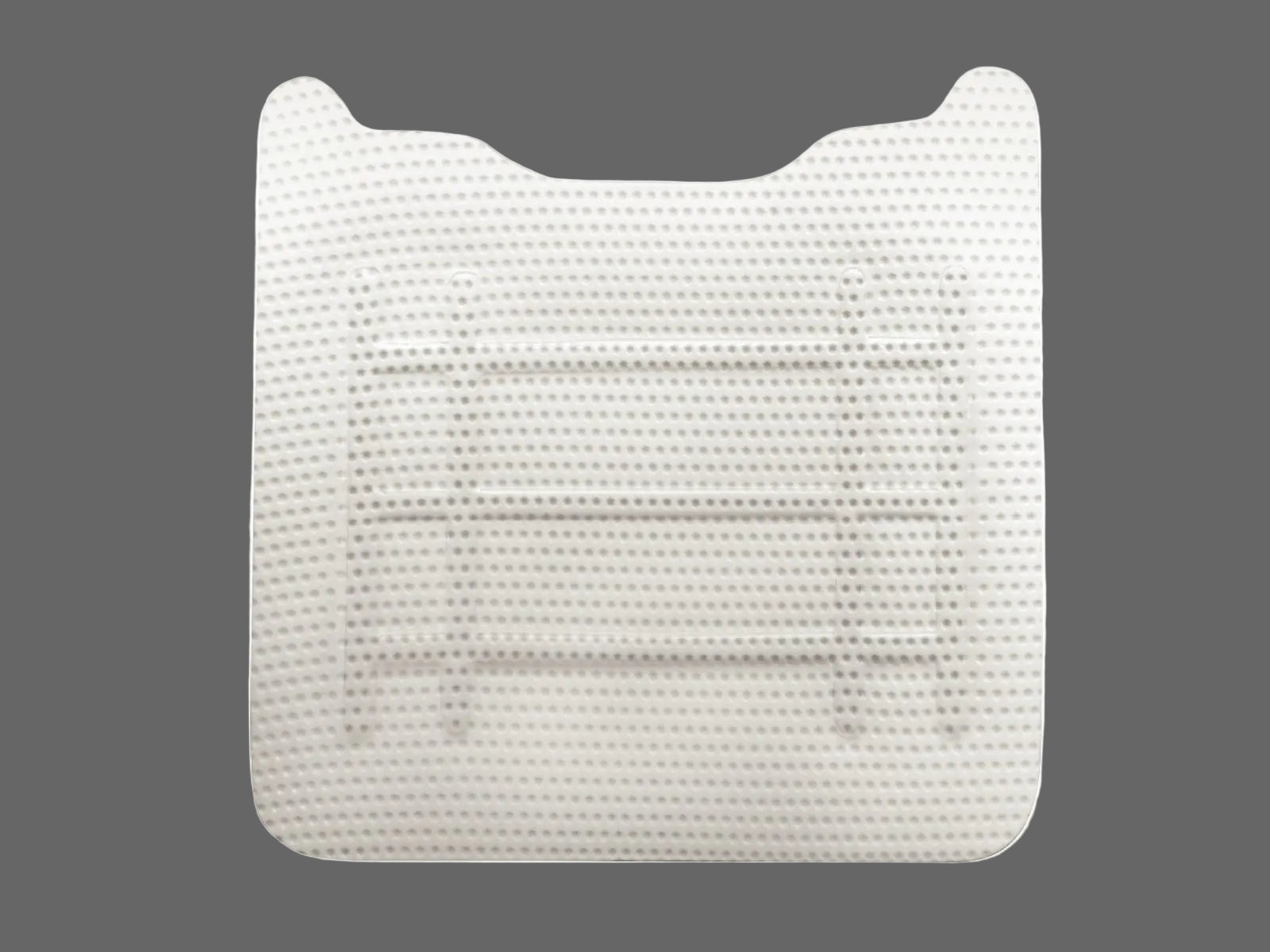 The Cytoplast™ Ti-250 Titanium-Reinforced PTFE Membrane (250 μm) by Osteogenics features a contoured upper edge and horizontal grooves, ideal for ridge augmentation or guided bone regeneration, shown against a plain gray background.