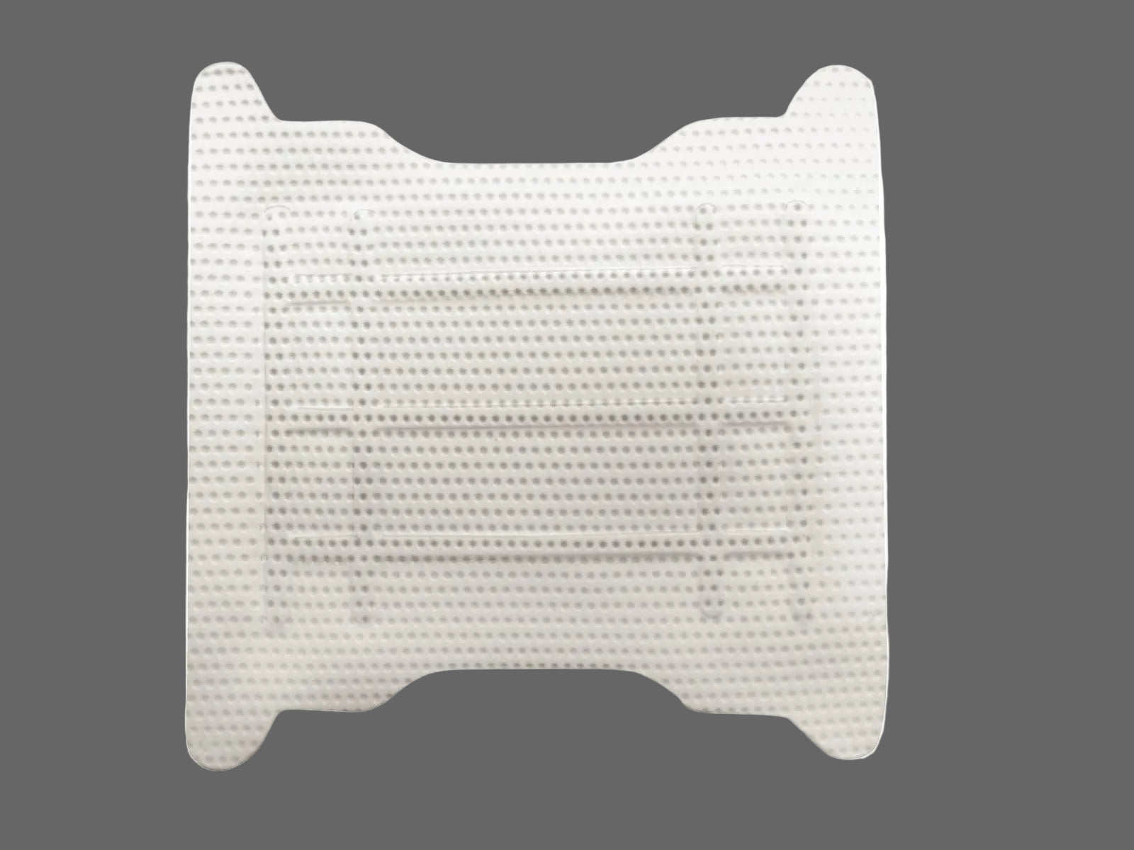 A close-up of the Osteogenics Cytoplast™ Ti-250 Titanium-Reinforced PTFE Membrane (250 μm), a white, rectangular, textured strip with rounded ends and a dotted surface, designed for ridge augmentation or guided bone regeneration.