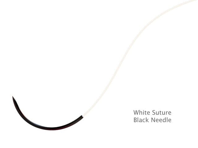 White PTFE suture with black needle on a white background
