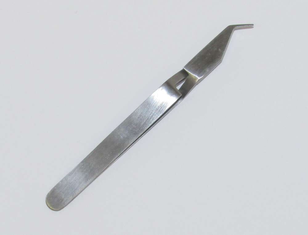 A pair of Xemax Cusp-Lok® Placement Instruments featuring angled, pointed tips, perfect for expose-and-bond procedures, shown on a plain white surface.